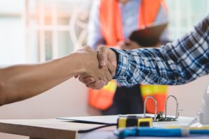Builders Merchants And Distributors Are Big Winners In Major Changes At JCW Acoustic Supplies. Team shaking hand