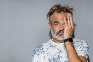 What Can You Do If Your Music Annoys The People Next Door? Annoyed man